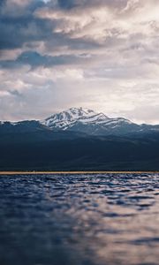 Preview wallpaper mountain, water, blur, peaks, clouds