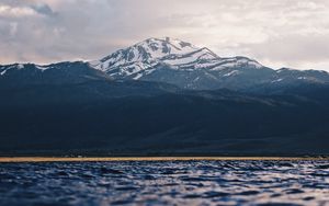 Preview wallpaper mountain, water, blur, peaks, clouds