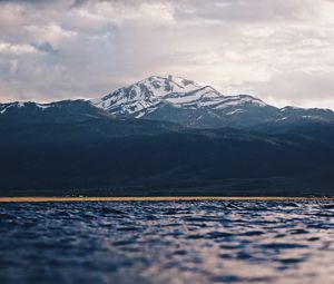 Preview wallpaper mountain, water, blur, peaks, clouds