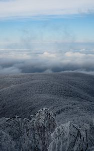 Preview wallpaper mountain, winter, clouds, frost, peak, sky