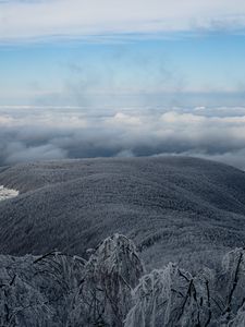 Preview wallpaper mountain, winter, clouds, frost, peak, sky