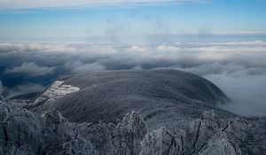 Preview wallpaper mountain, winter, clouds, frost, peak, sky