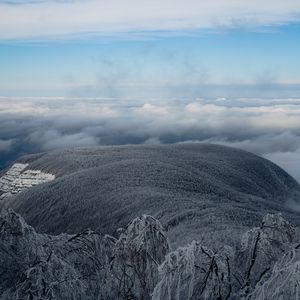 Preview wallpaper mountain, winter, clouds, frost, peak, sky