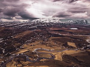 Preview wallpaper mountains, aerial view, road, snow, winter, iceland