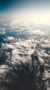 Preview wallpaper mountains, aerial view, snowy, peaks, clouds, sky
