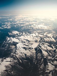 Preview wallpaper mountains, aerial view, snowy, peaks, clouds, sky