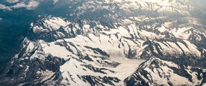 Preview wallpaper mountains, aerial view, snowy, peaks, clouds, sky