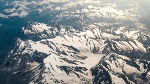 Preview wallpaper mountains, aerial view, snowy, peaks, clouds, sky