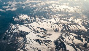 Preview wallpaper mountains, aerial view, snowy, peaks, clouds, sky