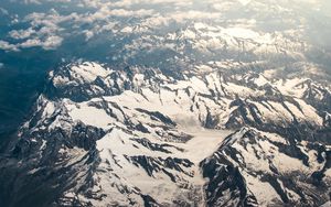 Preview wallpaper mountains, aerial view, snowy, peaks, clouds, sky