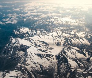 Preview wallpaper mountains, aerial view, snowy, peaks, clouds, sky