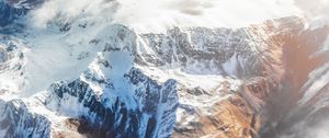 Preview wallpaper mountains, aerial view, tops, snow, clouds