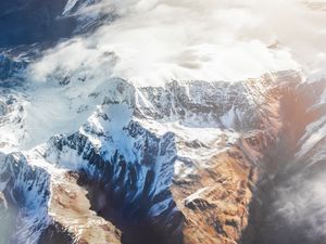 Preview wallpaper mountains, aerial view, tops, snow, clouds