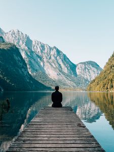 Preview wallpaper mountains, alone, lake, pier, solitude