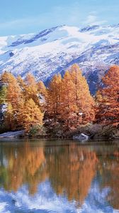 Preview wallpaper mountains, autumn, trees, reflection, lake, sun