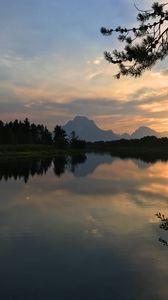 Preview wallpaper mountains, branches, lake, trees, sunset