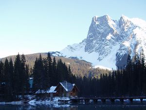 Preview wallpaper mountains, bridge, small house, structure, top, lake, trees, fur-trees