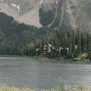 Preview wallpaper mountains, building, river, trees, spruce