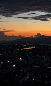 Preview wallpaper mountains, buildings, lights, city, dawn, dark