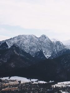 Preview wallpaper mountains, buildings, sky, peaks, snow