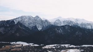 Preview wallpaper mountains, buildings, sky, peaks, snow