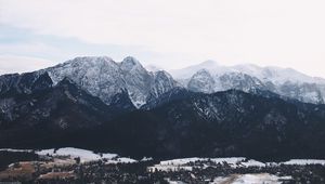 Preview wallpaper mountains, buildings, sky, peaks, snow