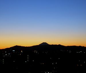 Preview wallpaper mountains, buildings, sunrise, dark