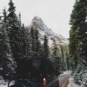 Preview wallpaper mountains, car, road, snow, snowy
