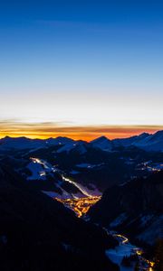 Preview wallpaper mountains, city, aerial view, valley, lights, night