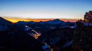 Preview wallpaper mountains, city, aerial view, valley, lights, night