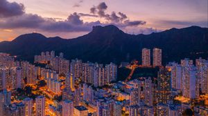 Preview wallpaper mountains, city, buildings, lights, apartments