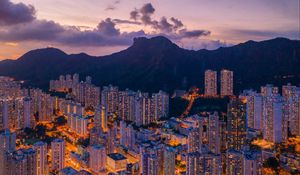 Preview wallpaper mountains, city, buildings, lights, apartments