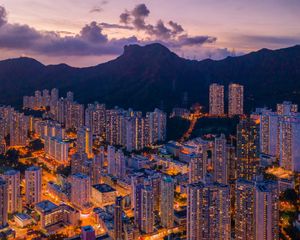 Preview wallpaper mountains, city, buildings, lights, apartments