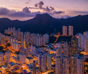 Preview wallpaper mountains, city, buildings, lights, apartments