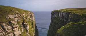 Preview wallpaper mountains, cliff, grass, sea, landscape