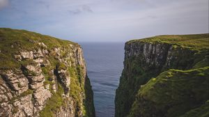 Preview wallpaper mountains, cliff, grass, sea, landscape