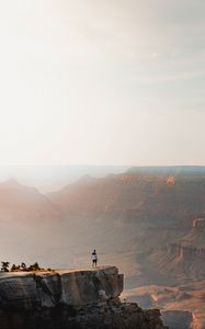 Preview wallpaper mountains, cliff, man, rock, height