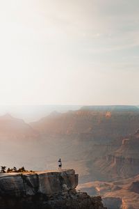 Preview wallpaper mountains, cliff, man, rock, height