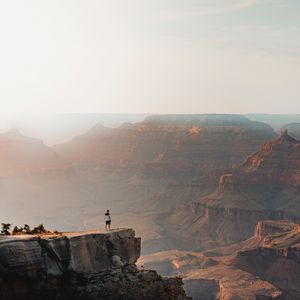 Preview wallpaper mountains, cliff, man, rock, height