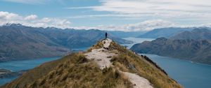 Preview wallpaper mountains, cliff, silhouette, lake, distance