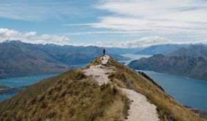 Preview wallpaper mountains, cliff, silhouette, lake, distance