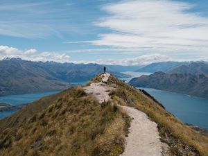 Preview wallpaper mountains, cliff, silhouette, lake, distance