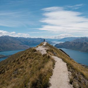 Preview wallpaper mountains, cliff, silhouette, lake, distance