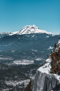 Preview wallpaper mountains, cliff, snow, snowy, peaks