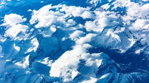 Preview wallpaper mountains, clouds, aerial view, peaks, snowy