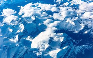 Preview wallpaper mountains, clouds, aerial view, peaks, snowy