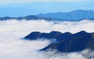 Preview wallpaper mountains, clouds, aerial view, mountain range, peaks