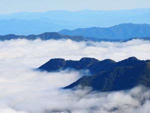 Preview wallpaper mountains, clouds, aerial view, mountain range, peaks