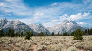 Preview wallpaper mountains, clouds, field, trees, landscape, nature
