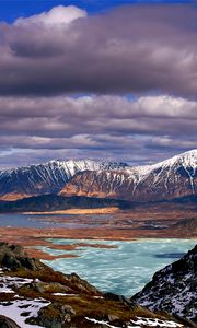 Preview wallpaper mountains, clouds, lake, height, sea, coast, snow, spring, sky